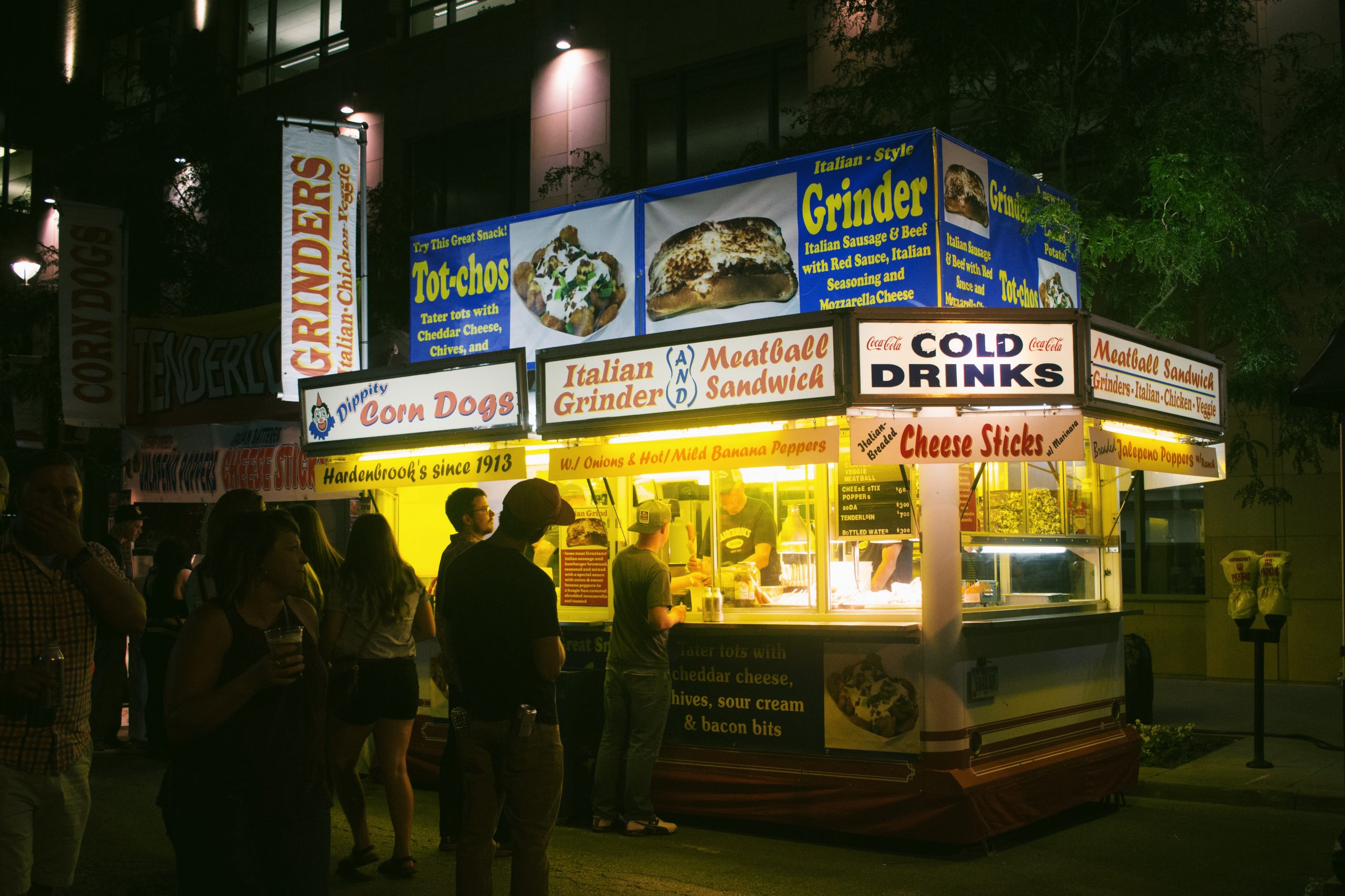 people ordering from food truck at night